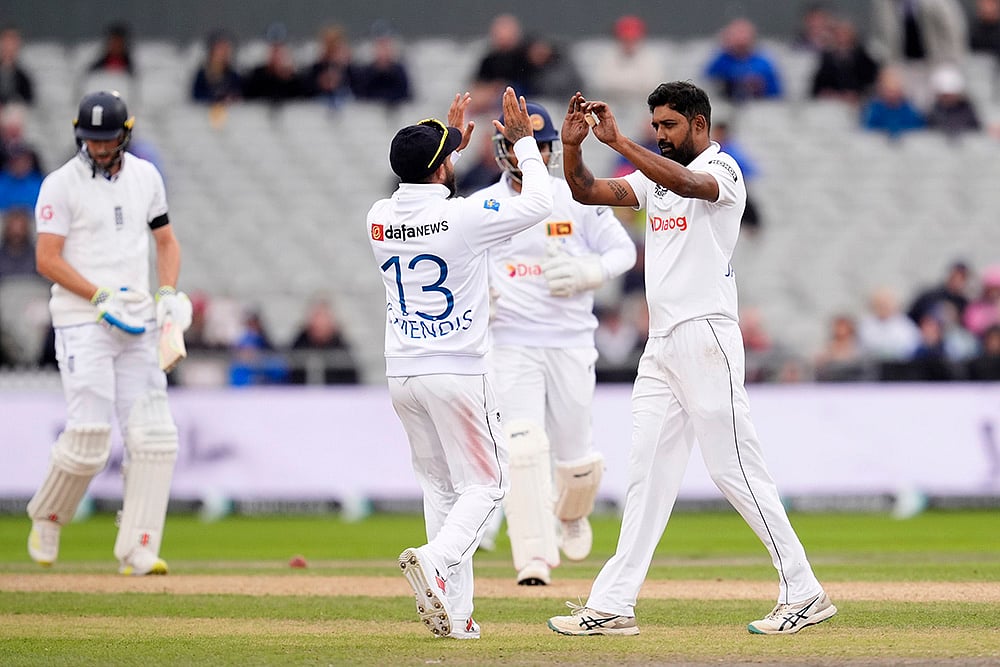 | Photo: Nick Potts/PA via AP : England vs Sri Lanka 1st Test Day 2: Sri Lanka's Prabath Jayasuriya celebrates England's Chris Woakes wicket